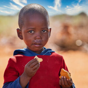 African child eating biscuits.